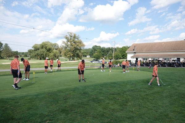 Tyrone Golf Team practicing on putting green at Sinking Valley Country Club.