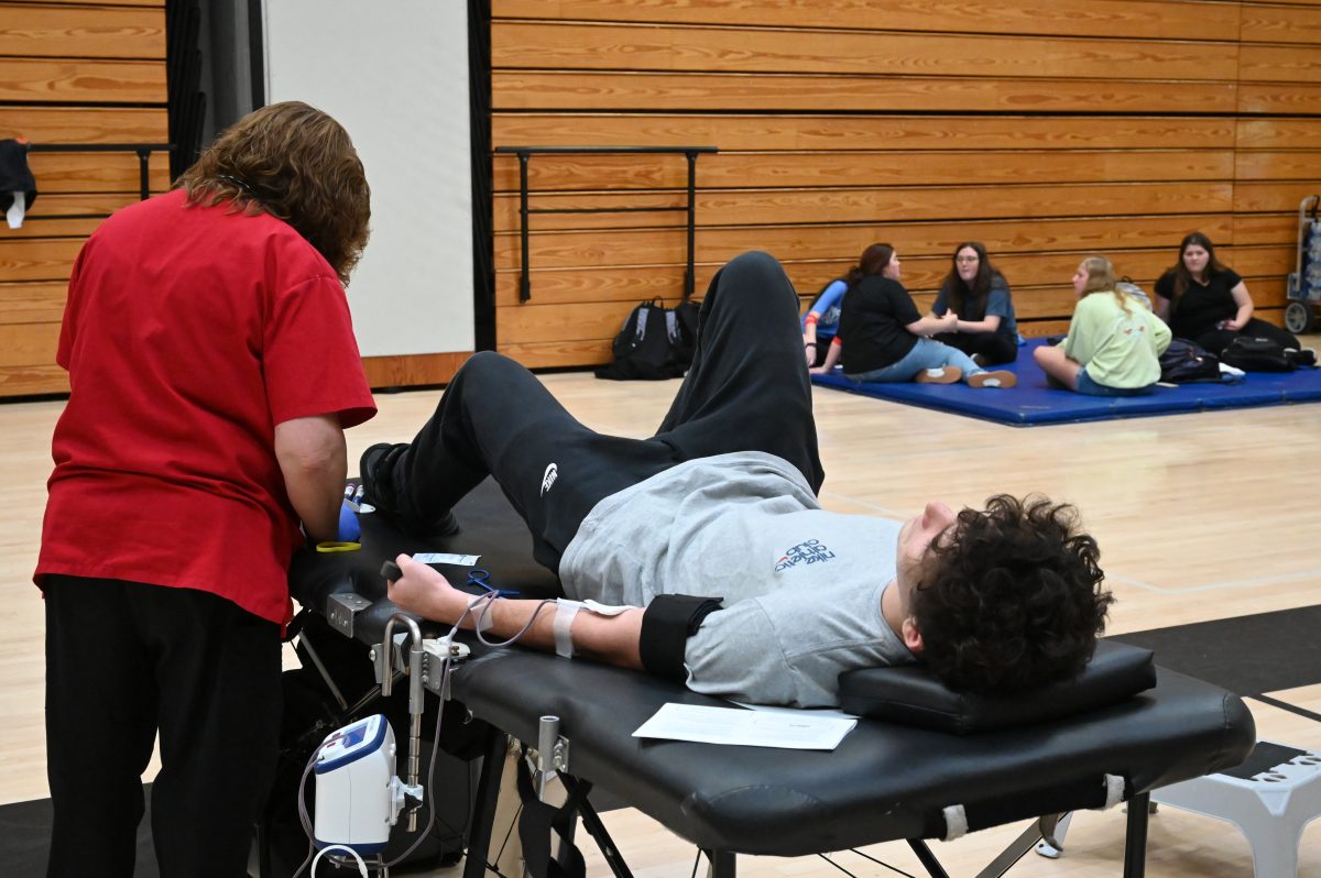 Tyrone senior Logan Rumberger giving blood at last fall's HOSA blood drive.