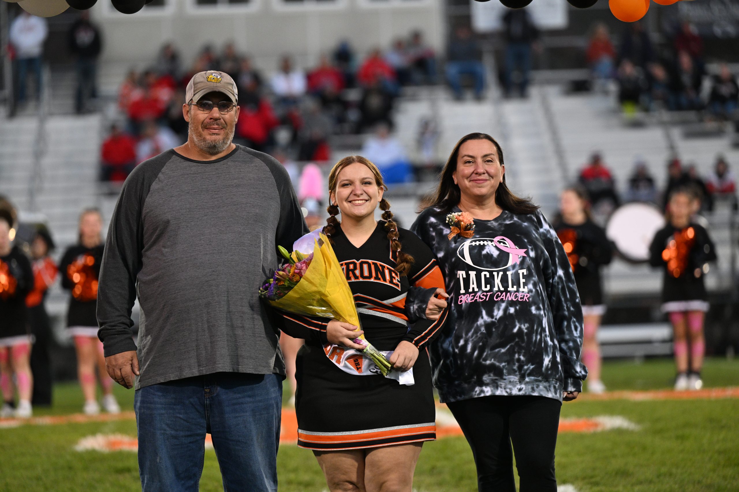 Lily Eckly and her parents during senior night