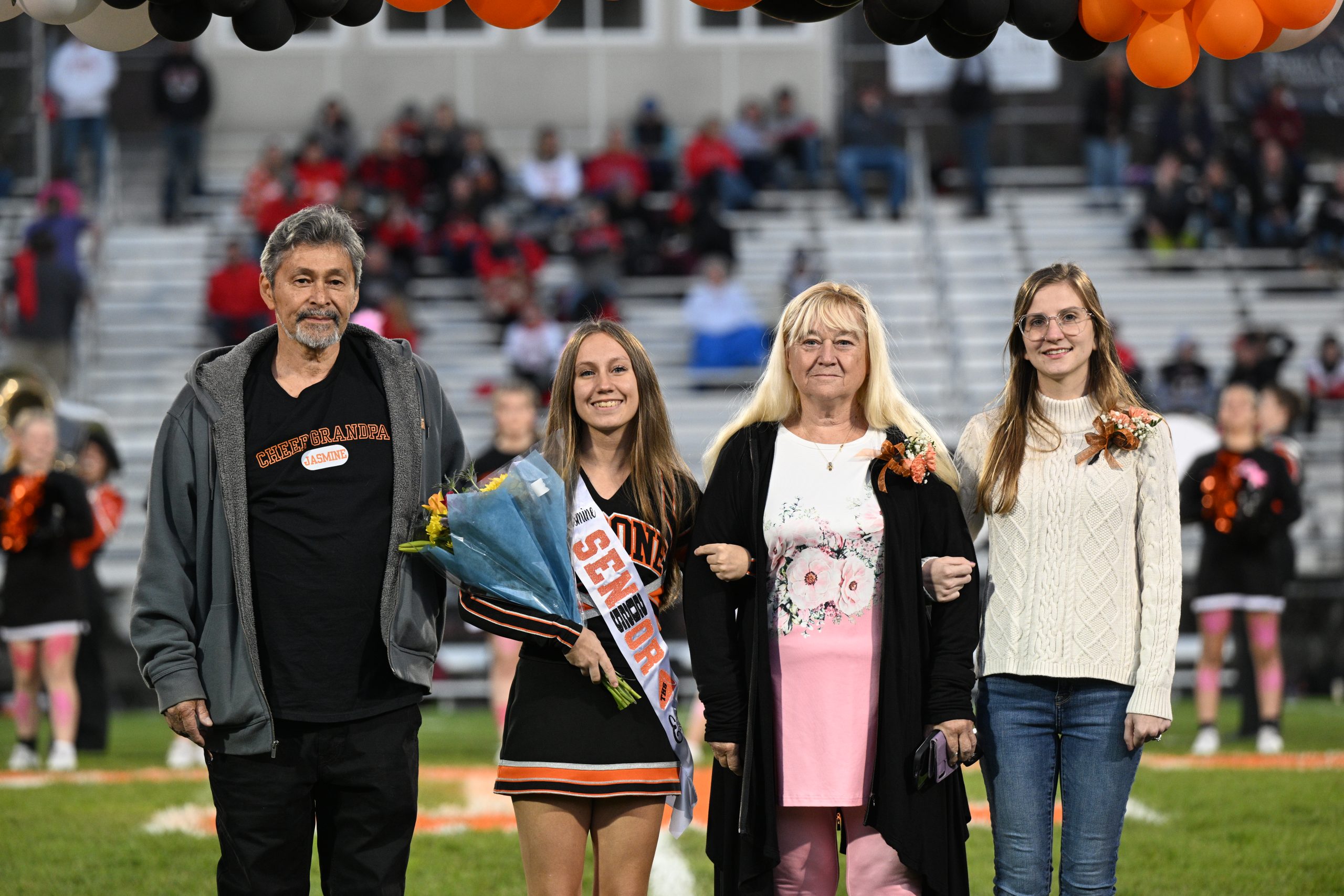 Jasmine Walk, her grandparents, and aunt during senior night