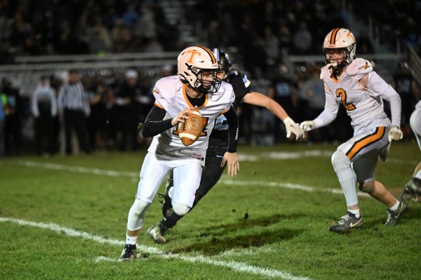 Tyrone quarterback Ashton Walk is flushed out of the pocket by the Penn Cambria defense.