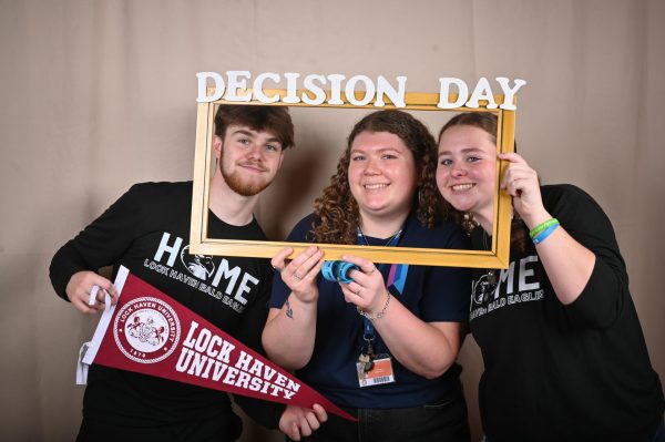 Former Tyrone High School College and Career Councilor Kelsey Broadfield poses with members of the class of 2024 on Senior Decision Day.