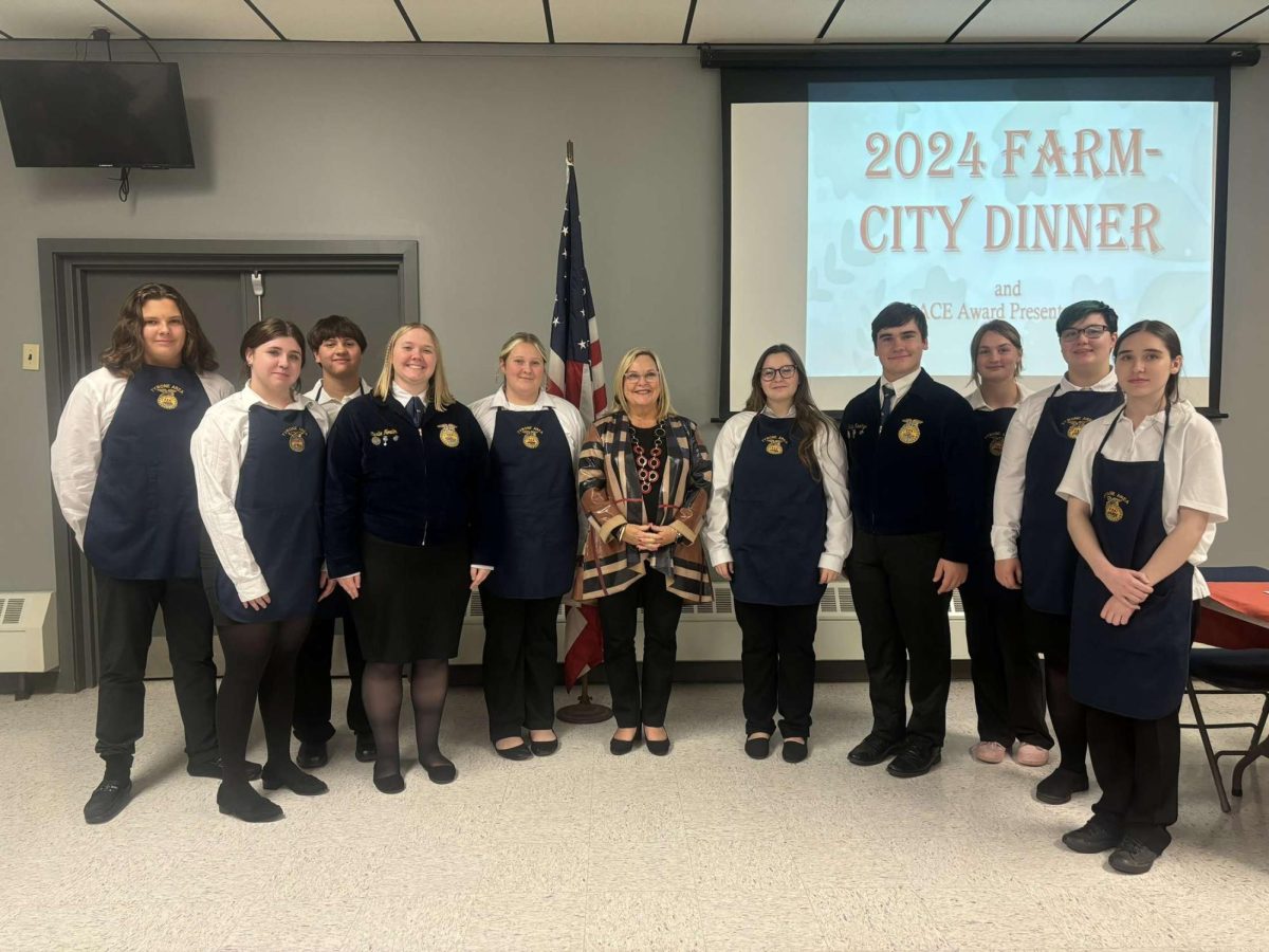 Members of the Tyrone Area FFA Members with Senator Judy Ward at the Farm-City breakfast. 