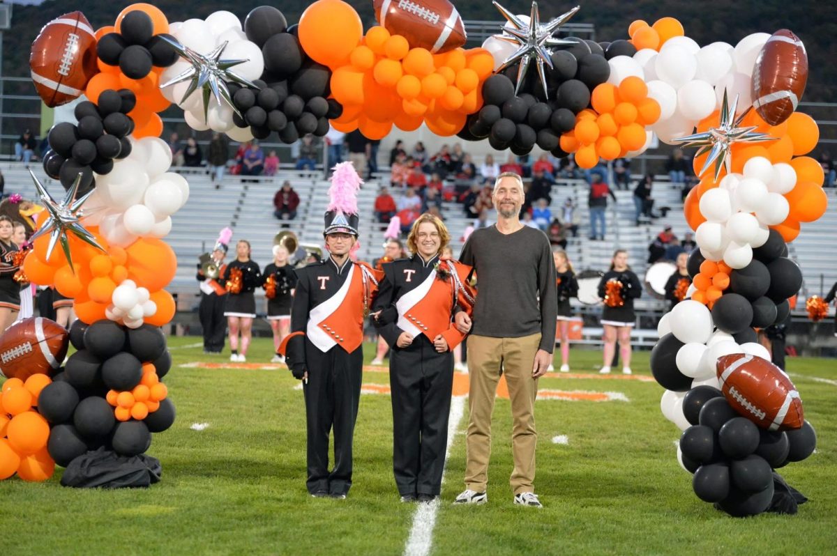 Emma Witkamp with Father and Sibling on Senior Night