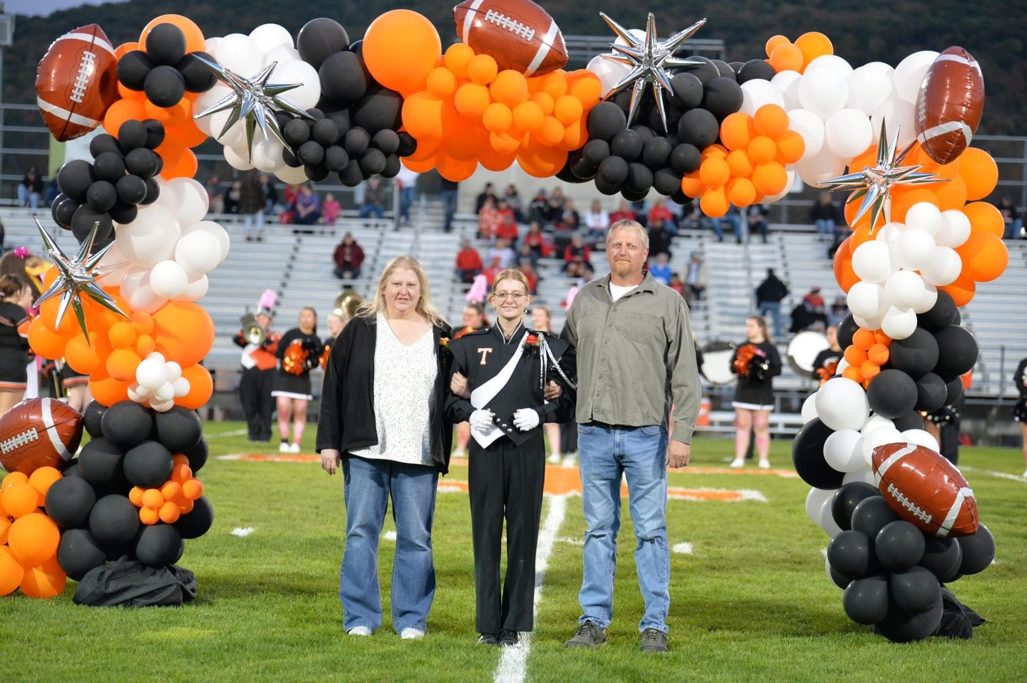 Lily Whited and Parents on Senior Night