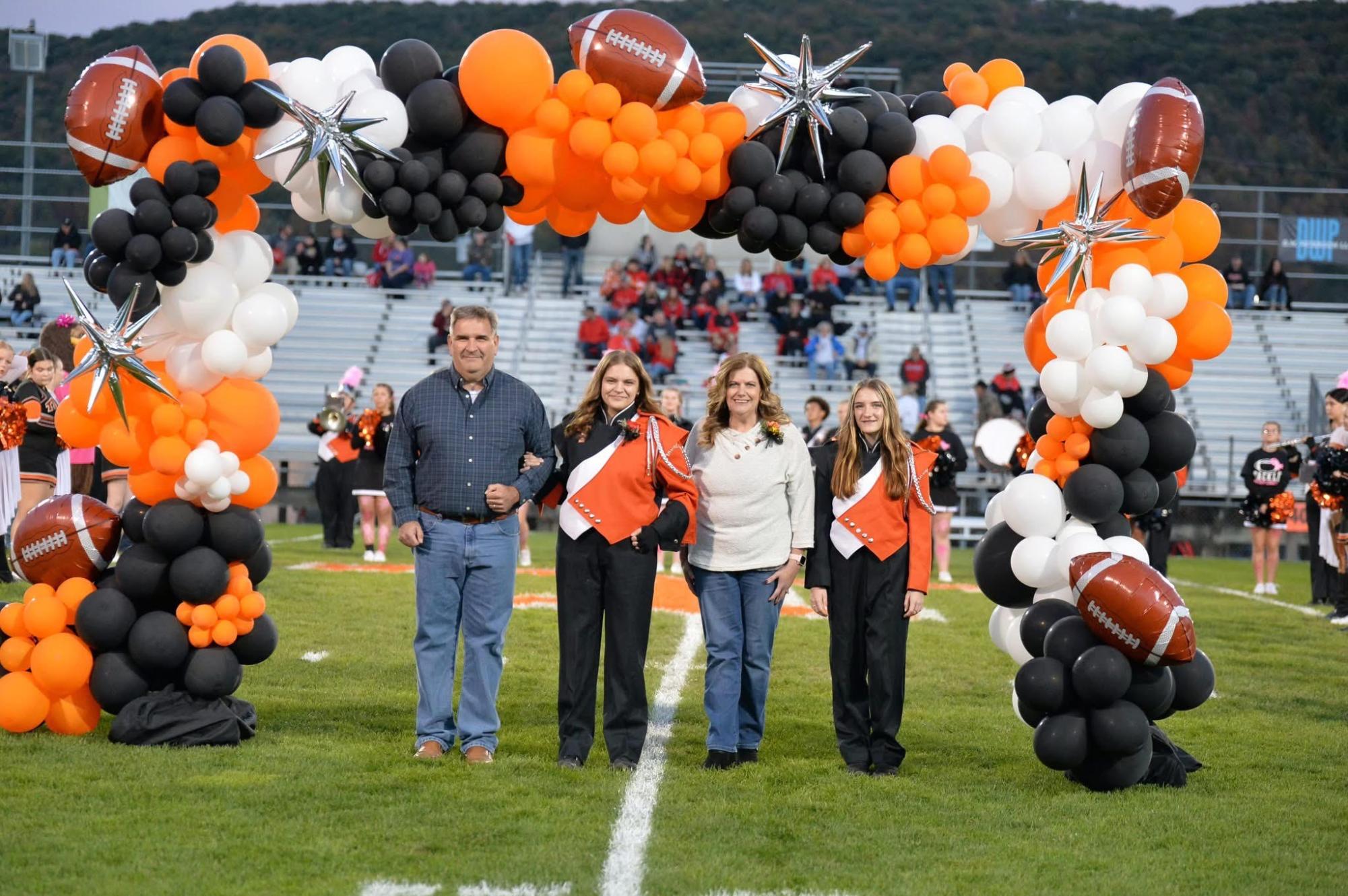 Lola Brown with Parents and Sibling on Senior night