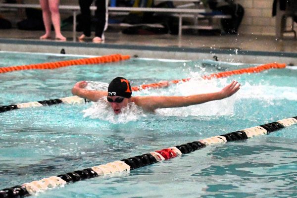 Tyrone's Patrick Van Kluenen swimming the 100 butterfly against Clearfield. 