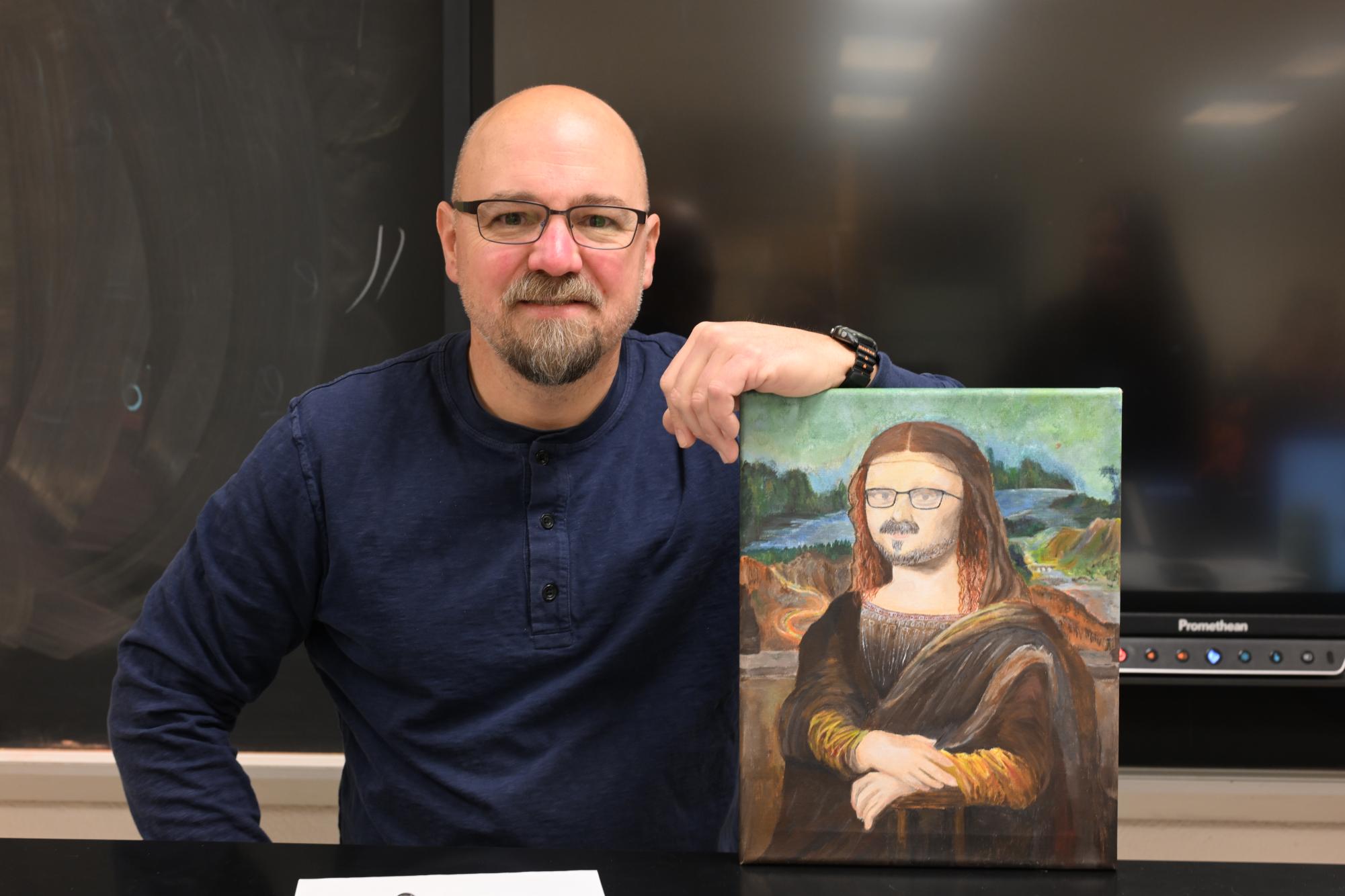 TAHS's own Renaissance Man Bryan Gruber with a Renaissance-style portrait of him painted by TAHS junior Kathy Sorokie.