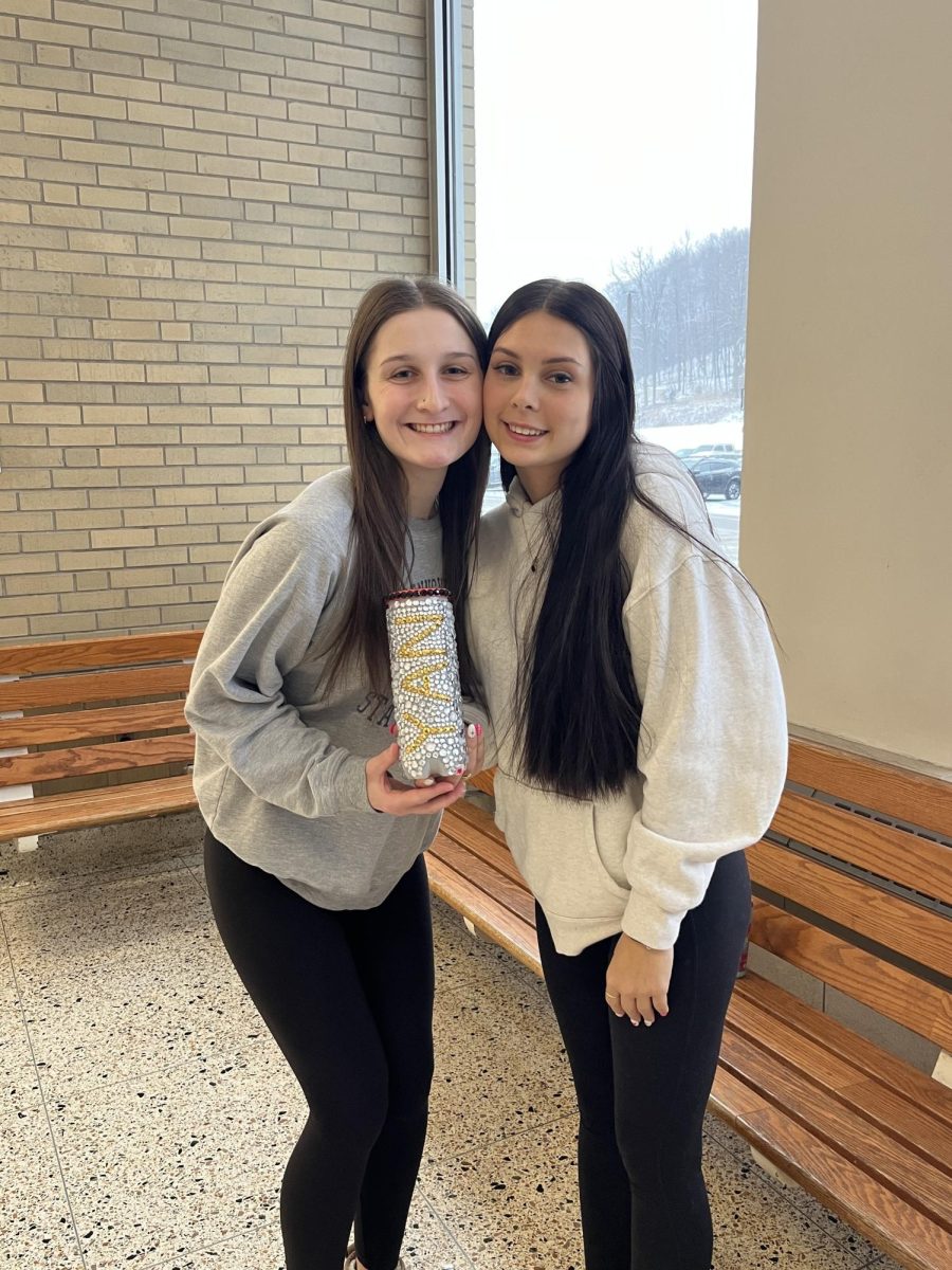 Cami Weyer and Mariyah Hunter with their penny jar