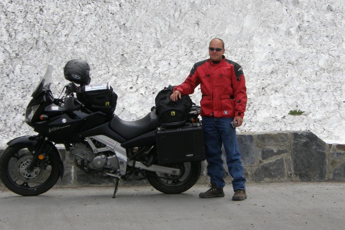 Gruber next to his motorcycle on his cross-continent trip from Pennsylvania to Alaska during the summer of 2007 (Courtesy of Bryan Gruber)