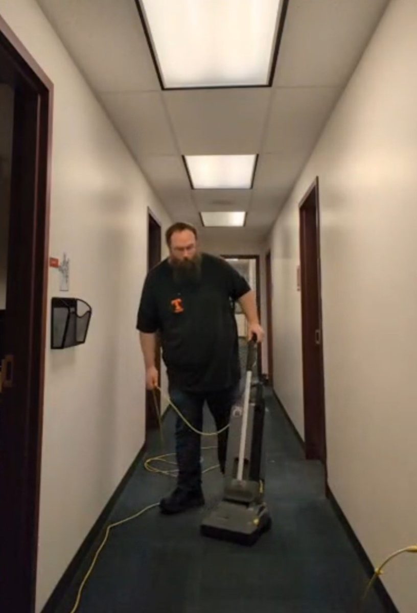 Friday cleaning the hall of the high school main office. 