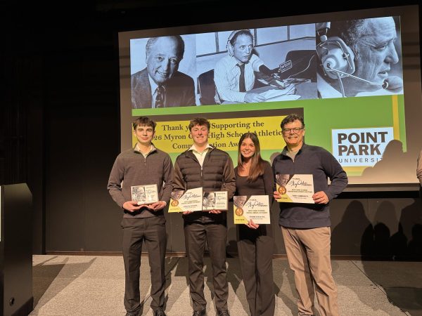 Eagle Eye staffers Carter Gwinn, Brayden Parsons, Layna Hess, and Adviser Todd Cammarata at the Myron Cope Awards in Pittsburgh. The Eagle Eye sports department took home five awards for 2026.